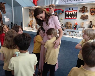 The Princess of Wales, Patron of the V&A, is given a hug by 8 year old Oihana (L) and Alice pupils of Globe Primary school in Bethnal Green where she officially opened the Young V&A ahead of its opening to the public on Saturday 1st July 2023.
