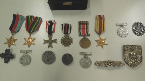Stolen war medals found alongside drugs and firearms during police search of Sydney motel room