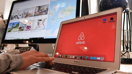 16 April 2018, Germany, Berlin: Airbnb's logo can be seen on different screens in Airbnb Germany GmbH's office in the Neue Schoenhauser Street. Airbnb is a community marketplace for people to book and rent accommodations Private and commercial lessors rent apartments with the support of agencies. Photo: Jens Kalaene/dpa-Zentralbild/dpa (Photo by Jens Kalaene/picture alliance via Getty Images)