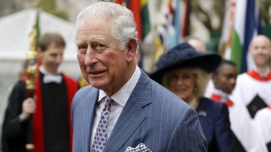 Prince Charles and Camilla the Duchess of Cornwall, in the background, leave after attending the annual Commonwealth Day service at Westminster Abbey in London.