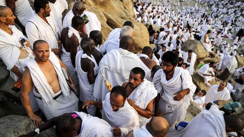 Muslim worshippers climb the Mount of Arafat during the Hajj pilgrimage, near Mecca. (AAP)