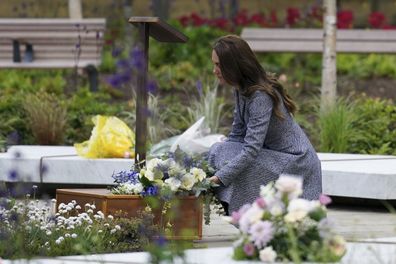 Catherine, Duchess Of Cambridge lays flowers as she and her husband Prince William, Duke of Cambridge attend the launch of the Glade of Light Memorial garden, outside Manchester Cathedral on May 10, 2022 in Manchester, England.  The Glade of Light Memorial commemorates the victims of the terrorist attack that took place after an Ariana Grande concert at Manchester Arena on May 22, 2017.  