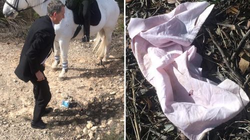 Police have located a book (left) and a torn piece of material (right) in the search area. (9NEWS)