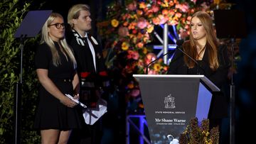 Summer Warne speaks on stage alongside Jackson Warne and Brooke Warne during the state memorial service for former Australian cricketer Shane Warne at the Melbourne Cricket Ground on March 30, 2022 in Melbourne, Australia. 