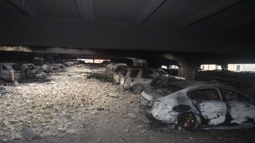 Ash and chunks of concrete carpet the floor in the ACC car park after the fire. Photo: Merseyside Fire and Rescue