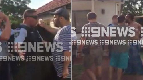 Two people have been charged following a scuffle with paramedics in Sydney's Inner West. 