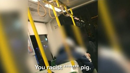 "You racist f---ing pig," the man says.