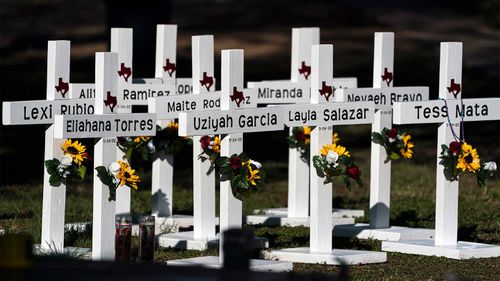 Crosses with the names of Tuesday's shooting victims are placed outside Robb Elementary School in Uvalde, Texas.