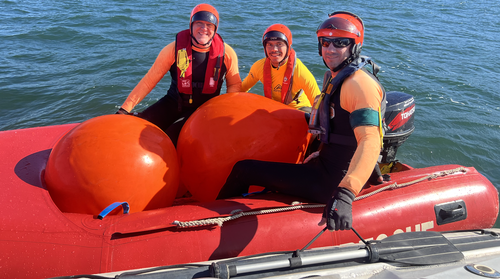 From left to right: Peter Bergman, Gamay ranger David Johnson and Chris Burrow-Jones beam at the camera after Johnson aced his training. 