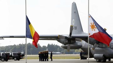 The bodies of the final group of MH17 victims so far discovered are unloaded in the Netherlands. (AAP)
