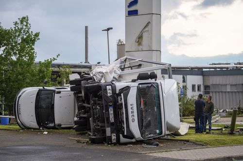 Two trucks overturned after a storm in Paderborn, Germany, Friday, May 20, 2022. 