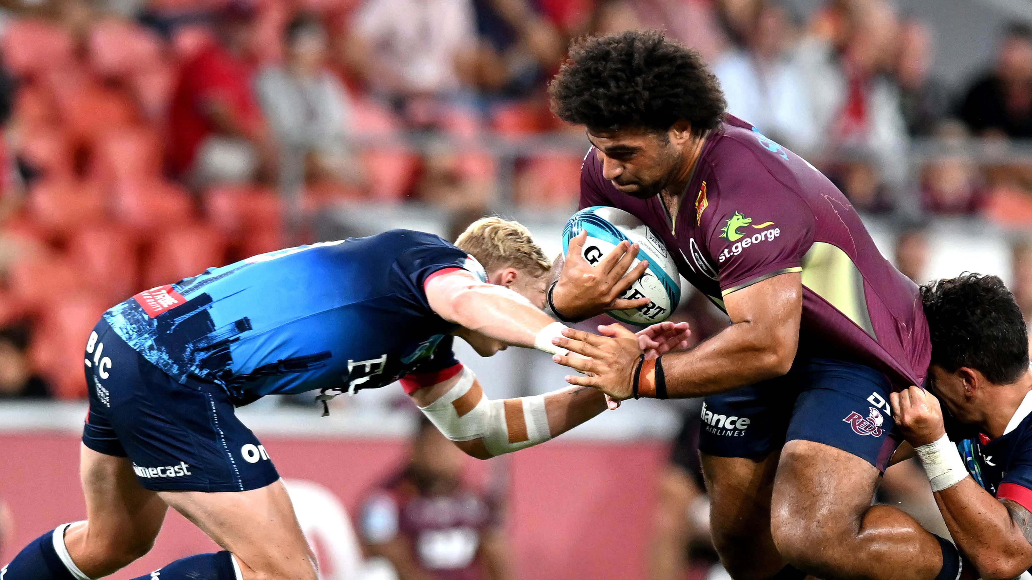 Zane Nonggorr of the Reds takes on the defence during the round one Super Rugby Pacific match between the Queensland Reds and the Melbourne Rebels 