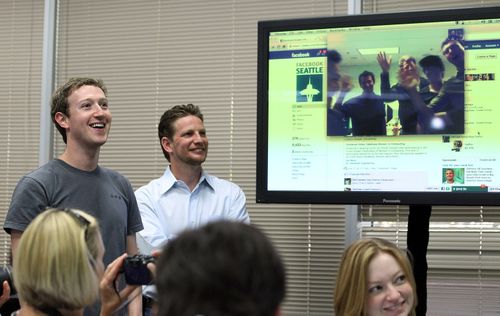 Facebook CEO Mark Zuckerberg watches a demonstration of Facebook video chat at Facebook headquarters in 2011.