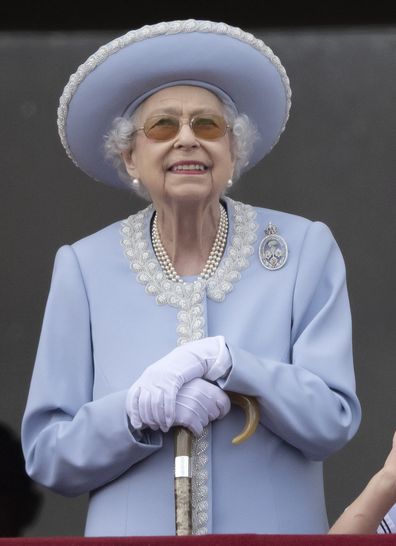 Queen Elizabeth II stands on the balcony of Buckingham Palace, London, as she watch a flypast of Royal Air Force aircraft pass over on Thursday, June 2, 2022. (Paul Grover, Pool Photo via AP)