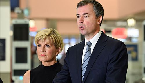 Foreign Minister Julie Bishop  and Justice Minister Michael Keenan at Sydney airport. (Photo: AAP).