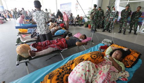 Locals sleeping at Palu airport in the earthquake-hit city.