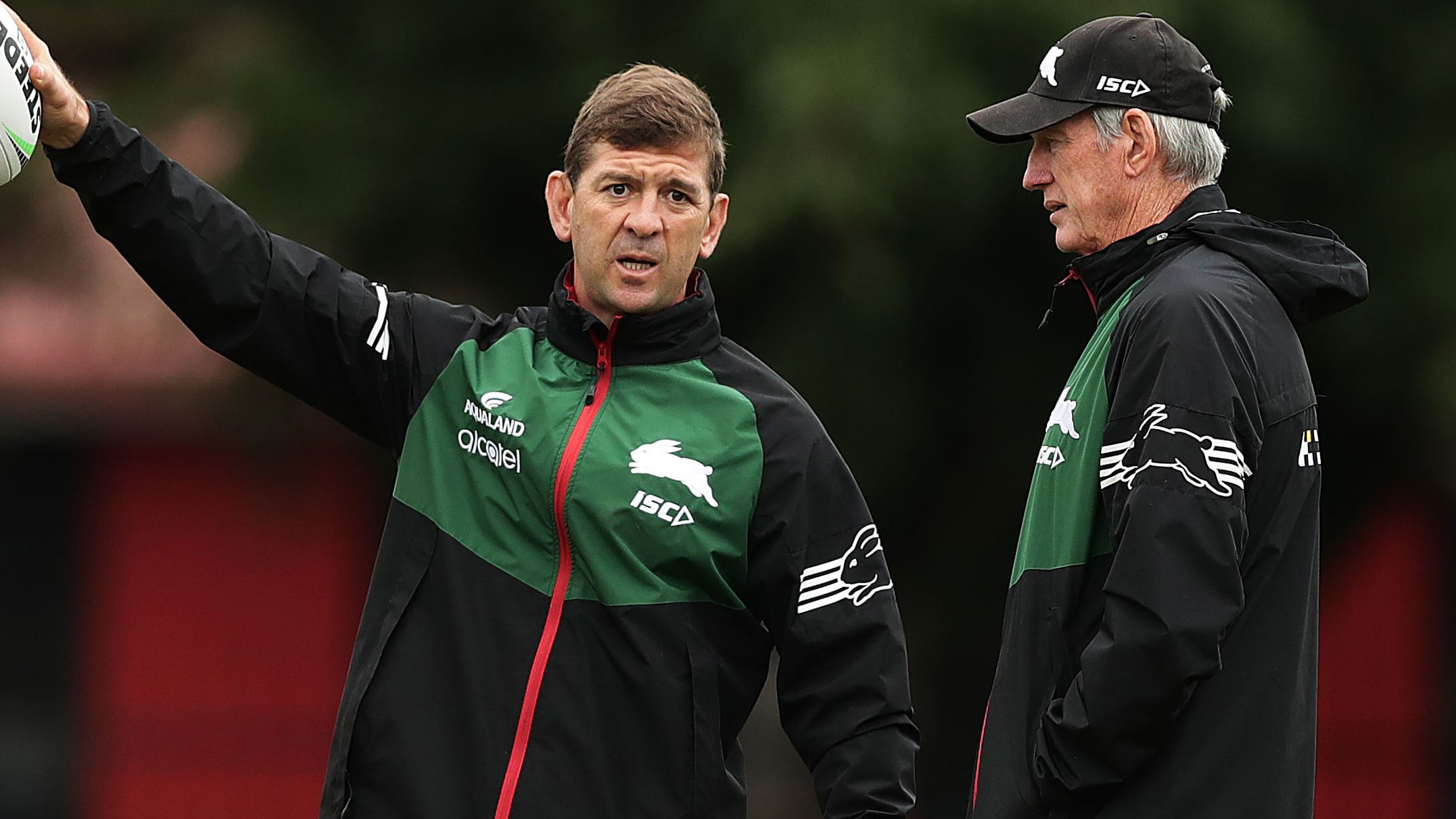 Then Rabbbitohs assistant coach Jason Demetriou talks to Wayne Bennett during a training session at Redfern Oval in 2020.