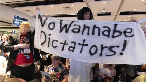 Libertarian delegates jeer Republican presidential candidate and former President Donald Trump as he speaks at the Libertarian National Convention.