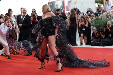 Chris Pine takes a picture of Florence Pugh on the Don't Worry Darling red carpet at the 79th Venice International Film Festival on September 05, 2022 in Venice, Italy. 