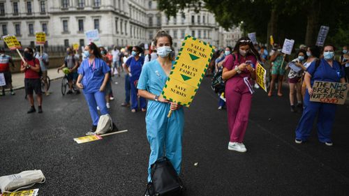 Healthcare workers take part in a protest over pay conditions in the NHS on August 8, 2020 in London, United Kingdom