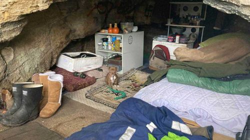 The cave that is home to Awhi and a dog he is looking after – Soxs.