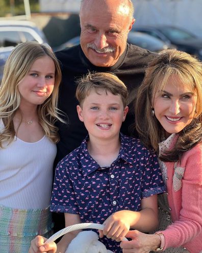 Dr. Phil McGraw and his wife Robin pose with their two eldest grandchildren over Easter.