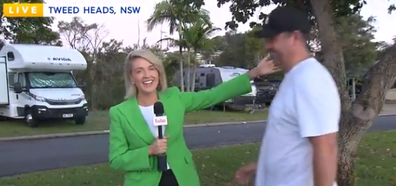 She then gestures for her husband Paul to join her on the tele.