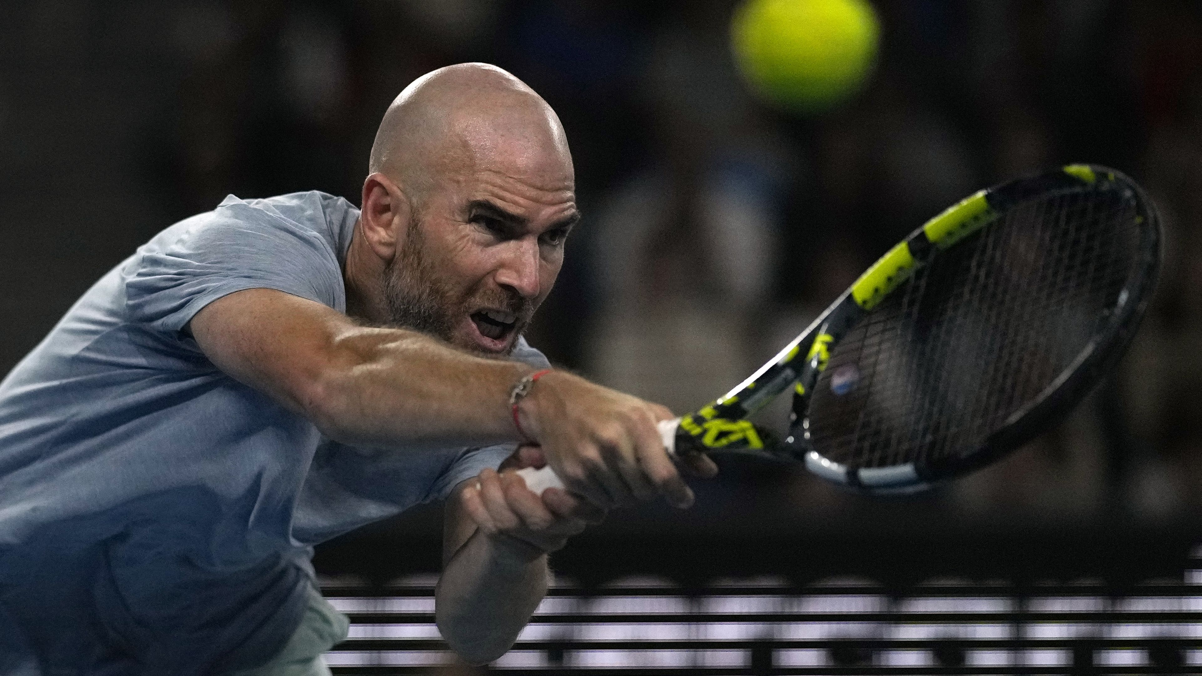 Adrian Mannarino of France plays a forehand return to Ben Shelton of the U.S. during their third round match at the Australian Open.