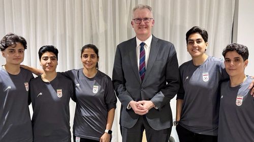Home Affairs Minister Tony Burke posted images with the footballers on his twitter after they were granted asylum.