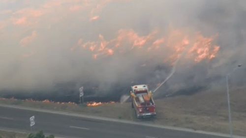 Firefighters have responded to a grass fire at Epping. (9NEWS)