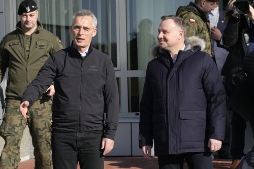 NATO Secretary General Jens Stoltenberg, left, gestures as he meets with Polish President Andrzej Duda in Lask, Poland, Tuesday, March 1, 2022. 