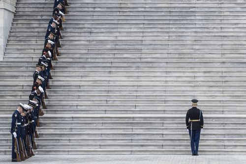 Service members prepare for the remains of President George H.W. Bush to be transported from the U.S. Capitol to the National Cathedral.