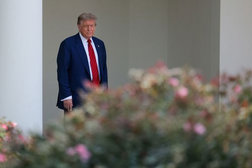 President Donald Trump walks out of the Oval Office and views the Rose Garden construction before boarding Marine One on the South Lawn of the White House on Friday, June 20, in Washington, DC.