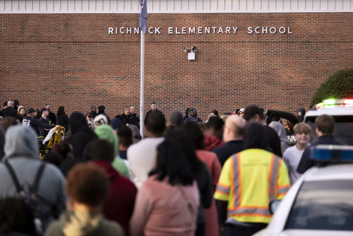 Students and police gather outside of Richneck Elementary School 