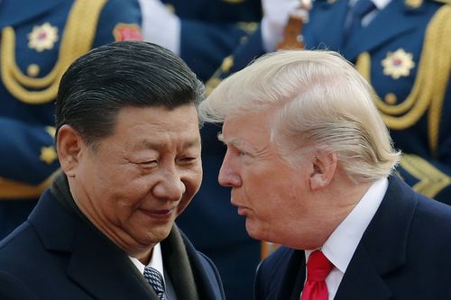 US President Donald Trump talks with Chinese President Xi Jinping during a welcoming ceremony at the Great Hall of the People in Beijing in 2017.