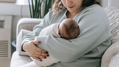 A woman with her baby. Stock image.