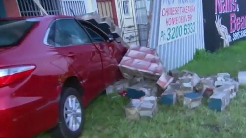 The car crashed into the back of a dentist's building. (9NEWS)