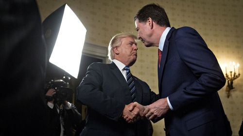 Donald Trump shakes hands with James Comey in January 2017.