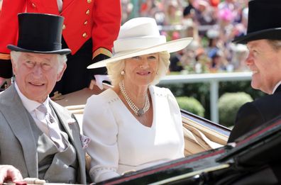 Prince Charles, Prince of Wales and Camilla, Duchess of Cornwall smile as they arrive into the parade ring on the royal carriage during Royal Ascot 2022 at Ascot Racecourse on June 15, 2022 in Ascot, England. 