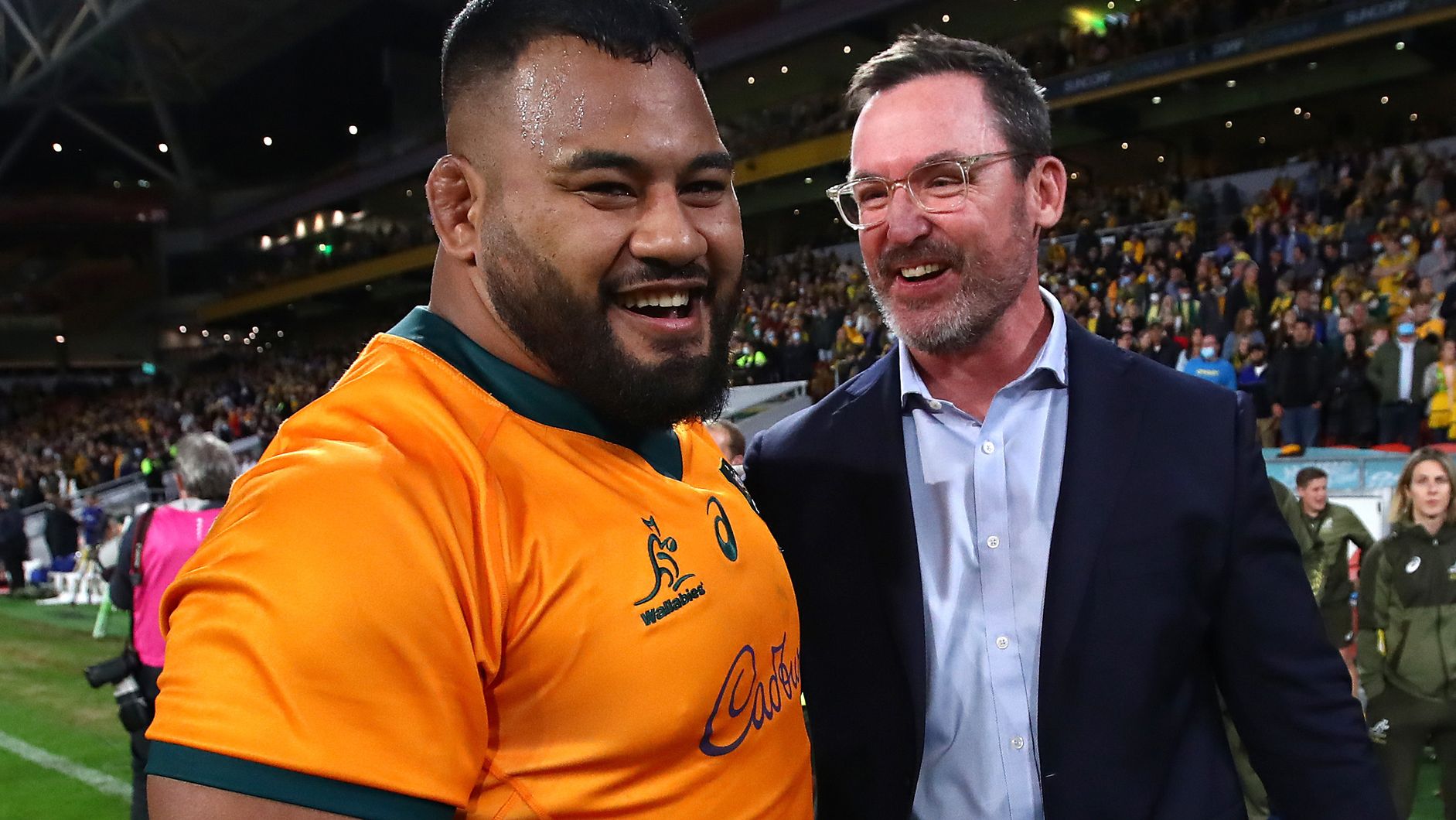 Taniela Tupou and assistant coach Dan McKellar of the Wallabies celebrate winning the international test match between the Wallabies and France in Brisbane in 2021.