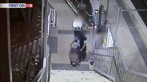 Parents bring young child along for Sydney train station robbery 