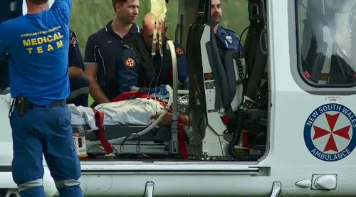 A 52-year-old man was airlifted to hospital in a serious condition from Stanwell Park Beach, south of Sydney, after crashing his hang glider (Supplied).