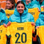Steph Catley, Sam Kerr and Katrina Gorry of the Matildas pose with their jerseys during Australia&#x27;s World Cup squad presentation at Federation Square on July 11, 2023. 