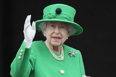 Queen Elizabeth II waves to the crowd during the Platinum Jubilee Pageant at the Buckingham Palace in London, Sunday, June 5, 2022, on the last of four days of celebrations to mark the Platinum Jubilee. 
