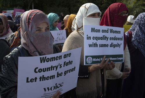  In this March 8, 2020 file photo Activists of the Pakistani religious party Minhaj-ul-Quran observe International Women's Day at a rally in Islamabad, Pakistan.