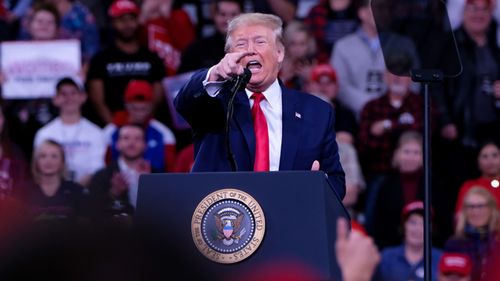 President Donald J. Trump speaks to his supporters at Make America Great Rally. Some critics argue Mr Trump has escalated violent nationalism in the US.