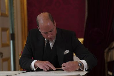 Britain's Prince William signs the oath to uphold the security of the Church in Scotland during the Accession Council at St James's Palace, London, Saturday, Sept. 10, 2022, where King Charles III is formally proclaimed monarch. (Victoria Jones/Pool Photo via AP)