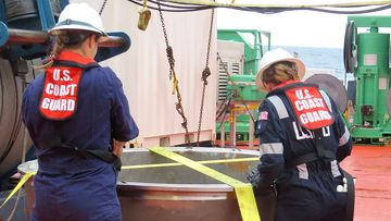 US Coast Guard engineers recover the endcap from the Titan submersible.