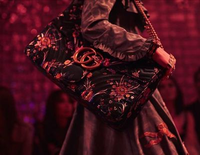 Alessandro Michele is letting his freak flag fly on all of Gucci's delightful odes to excess. Our pick? A satin matelass&eacute; floral printed GG Marmont bag.