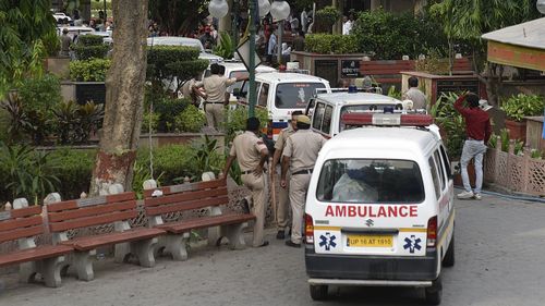 Ambulances carrying remains of  the family arrives at Nigam Bodh Ghat where last rituals of the deceased were performed. (Getty)